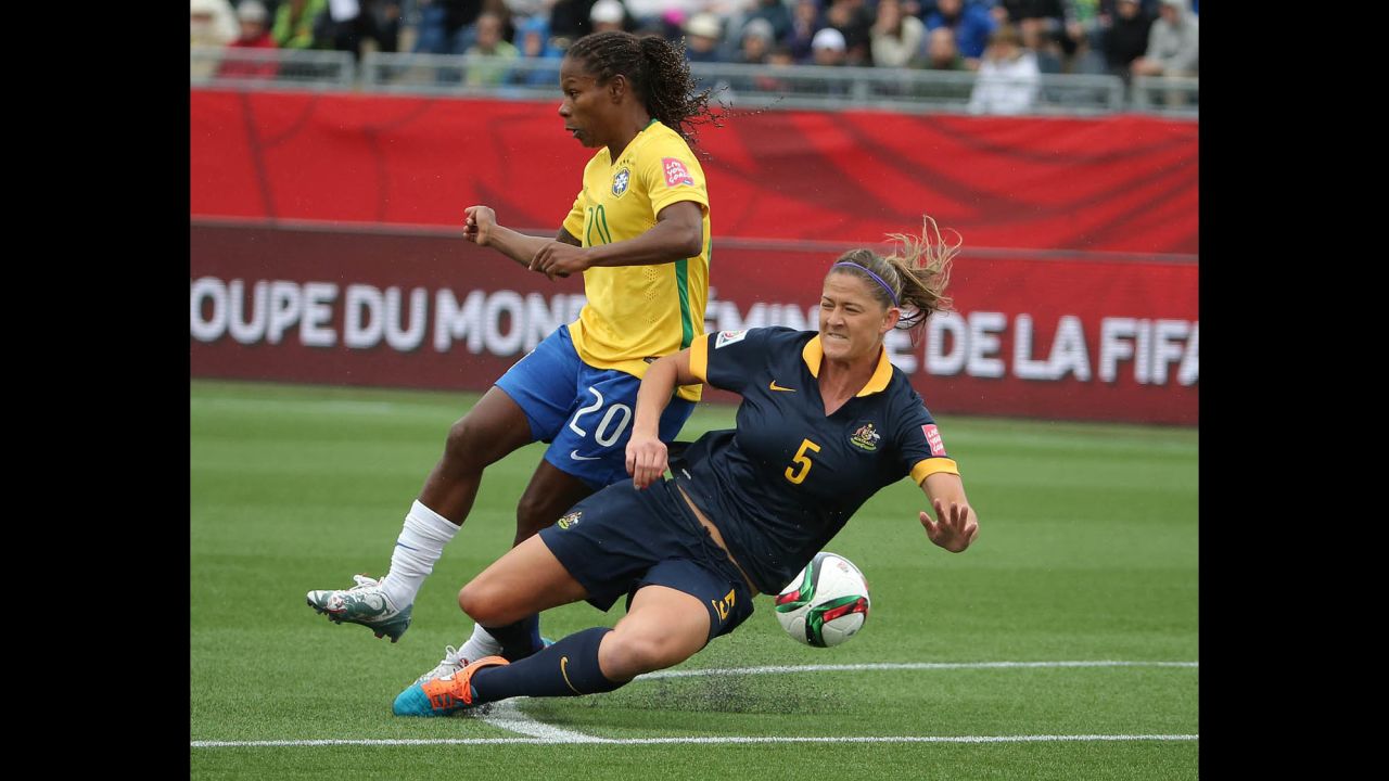 Australia's Laura Alleway, right, defends against Brazil midfielder Formiga during a match June 21 in Moncton, New Brunswick. Australia upset Brazil 1-0 to advance to the quarterfinals.