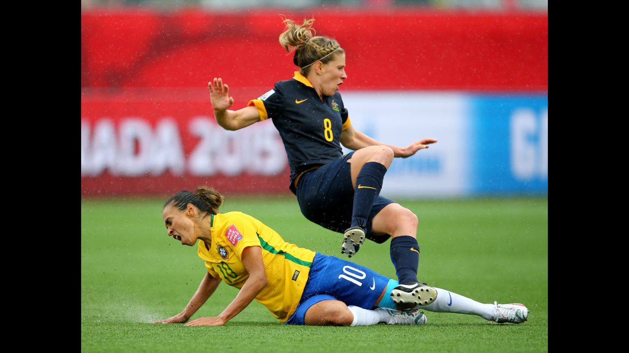 Brazil's Marta slides into Elise Kellond-Knight.