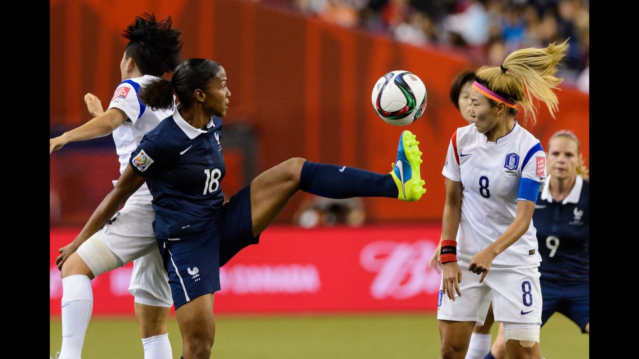 Marie Laure Delie of France kicks the ball in front of Cho So-hyun of South Korea during a round-of-16 match June 21 in Montreal. France won 3-0.