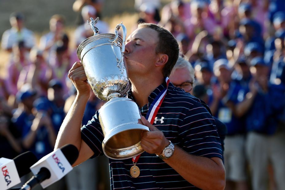 American Jordan Spieth lifts the U.S. Open trophy to add to the Masters crown he won earlier this year. He begins The Open looking to take a place in golfing history.