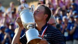 American Jordan Spieth lifts the U.S. Open trophy to add to the Masters crown he won earlier this year.