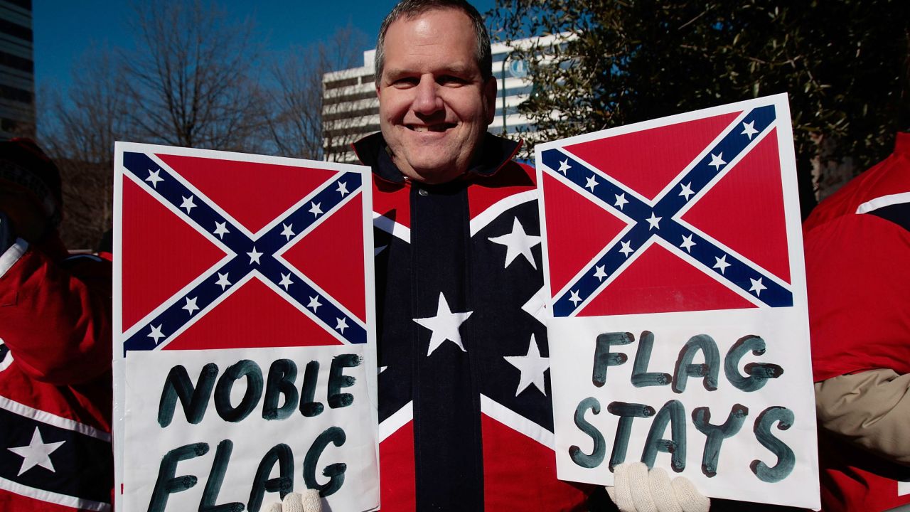 Dr. John Cobin of Greenville, South Carolina holds signs in support of displaying the Confederate flag at a Martin Luther King Day rally January 21, 2008 in Columbia, South Carolina.