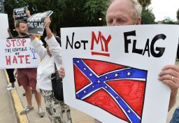 A man holds a sign at a rally against the Confederate flag in Columbia, South Carolina, on Saturday.  