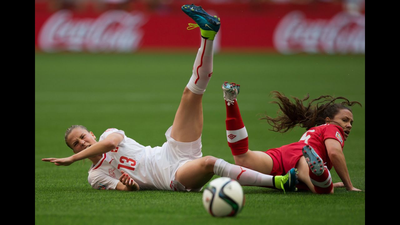Switzerland's Ana Maria Crnogorcevic and Canada's Allysha Chapman collide during the first half.