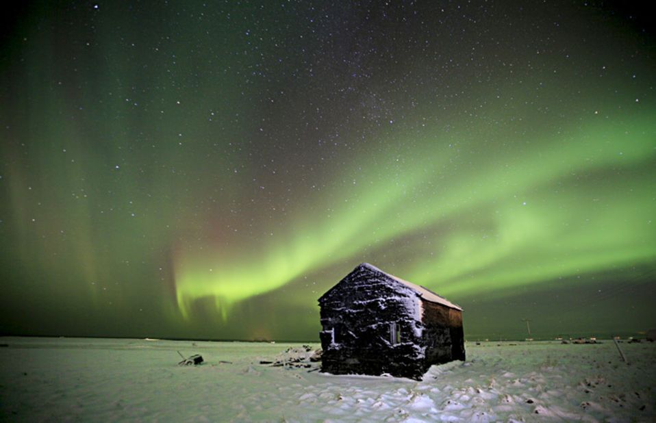 The northern lights dance on Nordic skies. <a href="http://ireport.cnn.com/docs/DOC-909923">Finnur Andrésson</a> took this image of the famous lights appearing over an abandoned farm in his hometown. "I am always amazed by their beauty when I see them," he said. "It's like another world." 