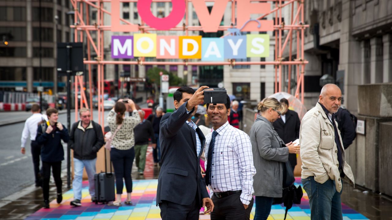 Commuters across the London Bridge on Monday were met with a mosaic of colorful sidewalk tiles and a banner urging them to "Love Mondays."