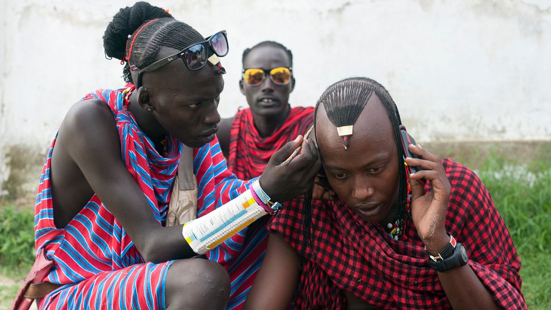 At the Maasai market, warriors and herdsmen sell ornate masks and carvings.