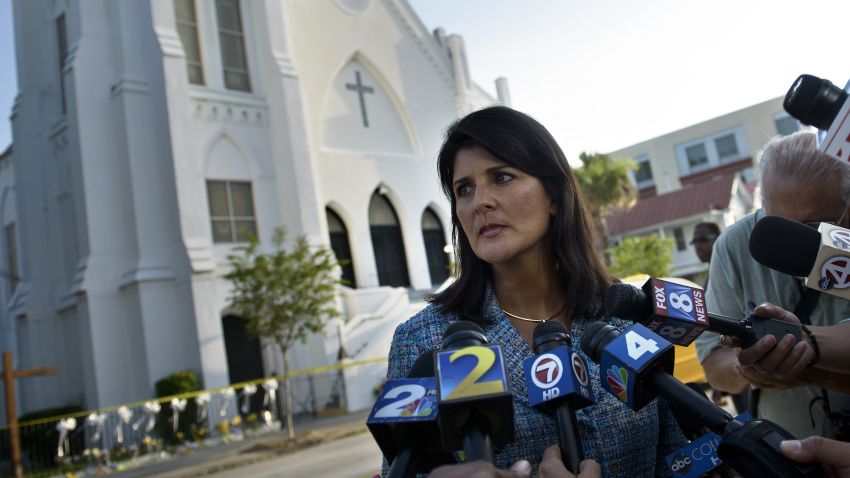 South Carolina Governor Nikki Haley speaks to press outside the Emanuel AME Church June 19, 2015 in Charleston, South Carolina.US police arrested a white high school dropout Thursday suspected of carrying out a gun massacre at one of America's oldest black churches, the latest deadly assault to fuel simmering racial tensions. Authorities detained 21-year-old Dylann Roof, shown wearing the flags of defunct white supremacist regimes in pictures taken from social media, after nine churchgoers were shot dead during a Bible study class on Wednesday evening.