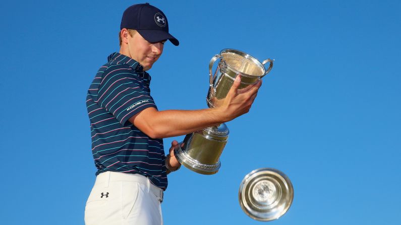 Jordan Spieth of the United States holds the trophy for the 115th U.S. Open Championship at Chambers Bay on Sunday, June 21, in University Place, Washington.  The <a href="index.php?page=&url=http%3A%2F%2Fedition.cnn.com%2F2015%2F06%2F21%2Fgolf%2Fgolf-us-open-spieth%2F" target="_blank">21-year-old is the youngest U.S. Open champion</a> since Bobby Jones in 1923 and only the sixth man in history to win this title and the Masters in the same year. Tiger Woods won it last, in 2002.