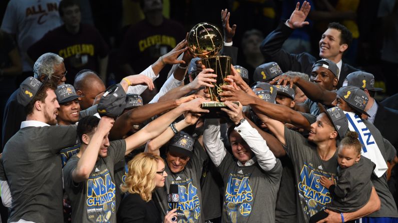 The Golden State Warriors celebrate their first NBA Finals title in 40 years after defeating the Cleveland Cavaliers 105-97 on Tuesday, June 16, in Cleveland.
