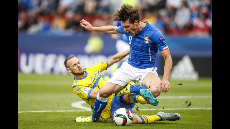 Alexander Milosevic of Sweden, left, tackles Andrea Belotti of Italy during the UEFA Under-21 European Championship on Thursday, June 18, in Olomouc, Czech Republic.