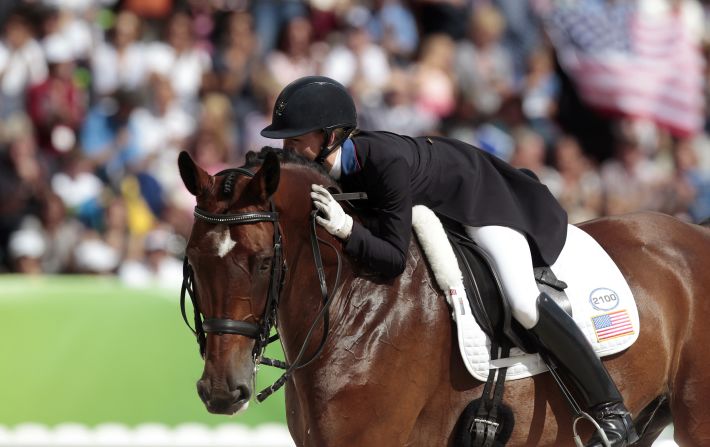 The American abandoned a fledgling career as a hairstylist in 2008 to pursue her dream of competing in dressage with her horse Verdades, who she spotted on a VHS video 13 years ago. 