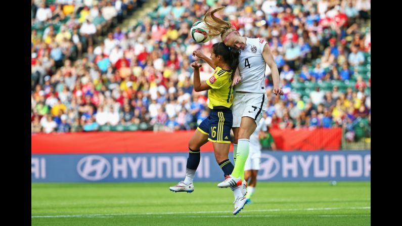 Becky Sauerbrunn, right, of the United States wins a header over Colombia's Lady Andrade during the FIFA Women's World Cup at Commonwealth Stadium in Edmonton, Canada, on Monday, June 22. The United States won 2-0. <a href="index.php?page=&url=http%3A%2F%2Fwww.cnn.com%2F2015%2F06%2F12%2Ffootball%2Fgallery%2Fusa-highlights-womens-world-cup%2Findex.html">See more photos of the U.S. team in the Women's World Cup</a>