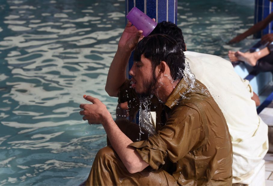 A Pakistani man cools down at a mosque during the heat wave in Karachi on June 22.