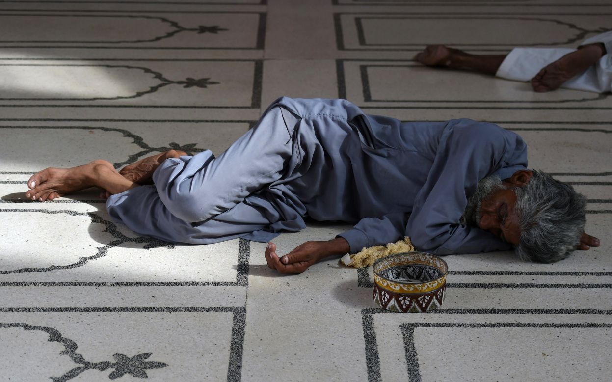 A Pakistani man rests at a mosque during the heat wave in Karachi on June 22.