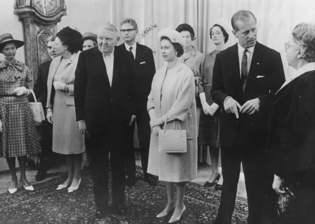 During the Queen's first official visit to Germany, she met with German Chancellor Ludwig Erhard (front left), here attending a luncheon at the Chancellery, Germany, on May 21, 1965. 