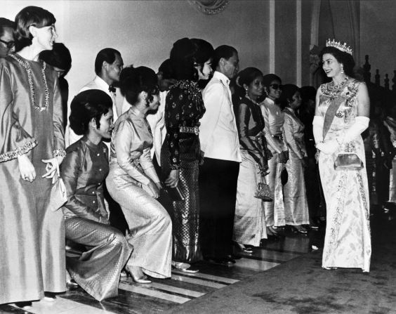The Queen's first visit to Thailand shows her here visiting the Grand Palace in Bangkok in February 1972.
