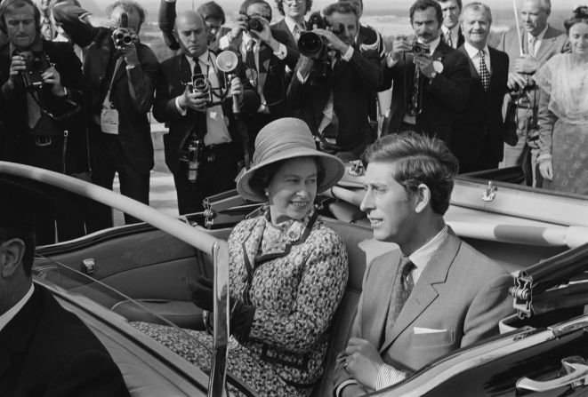 The Queen and Prince Charles seem to be enjoying their open-top car ride during a state visit to Avignon, France, in May 1972, three years after being invested with the title of Prince of Wales. 