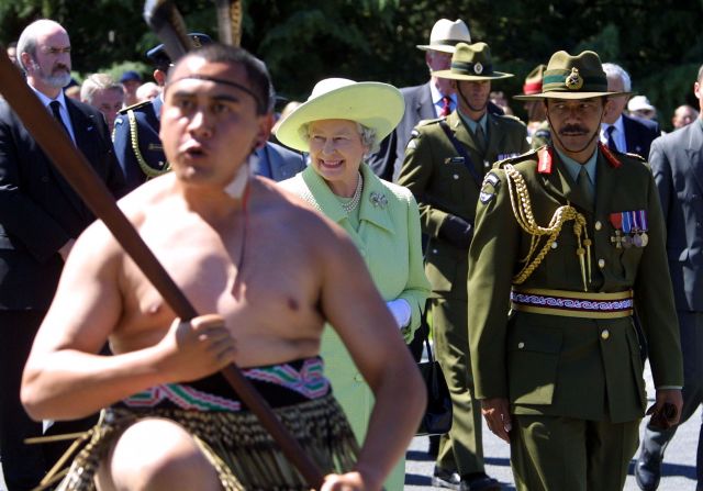 As the Queen visits a military camp in Christchurch, New Zealand, a Maori warrior performs the Haka in February 2002.