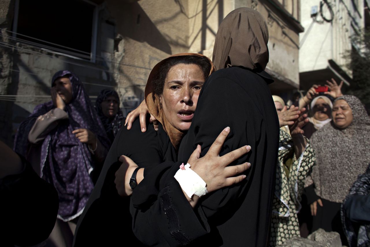 Heidi Levine, an American freelance photographer, was awarded the inaugural Anja Niedringhaus Courage in Photojournalism Award on Thursday. The honor is named for a German photojournalist who was killed last year covering the Afghan presidential election.<br />Levine covered last year's Gaza war extensively, taking some breathtaking photographs.<br /><br />Here, a woman reacts during the funeral for <a href="http://edition.cnn.com/2014/07/17/world/meast/mideast-conflict-children/" target="_blank">four boys killed while playing on the beach</a> in Gaza.<br /><br />"I don't know if it was the mother, because it was just so chaotic," Levine says. "It just looked like her whole life went blank ... almost like a ghost, in a sense."