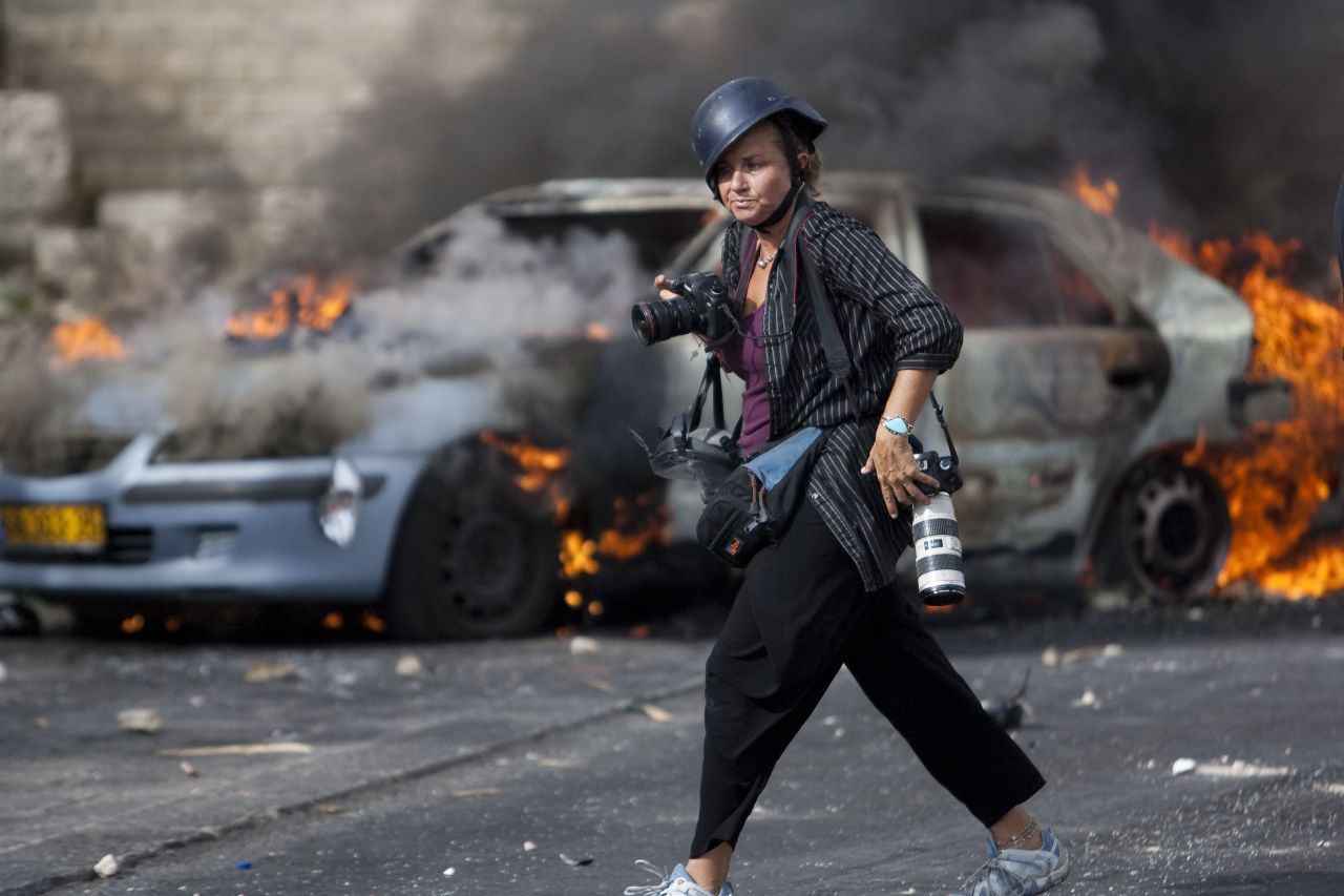 <a href="https://heidilevine.photoshelter.com/" target="_blank" target="_blank">Heidi Levine</a> is based in Jerusalem and has been on the front lines of many Mideast conflicts over the course of her career. Her work covering the 2014 war in Gaza won her <a href="https://www.cnn.com/2015/06/25/world/gallery/amanpour-heidi-levine/index.html" target="_blank">the first-ever Anja Niedringhaus Award</a> for courage in photojournalism. "Some people look at us as adrenaline junkies, but for me and the majority of the colleagues I have known throughout my career, we are simply addicted to making a difference in this world," she said. "I want my audience to know that, for me, the most important tool I take with me is not my camera, but my heart and my empathy for the people that I have documented."