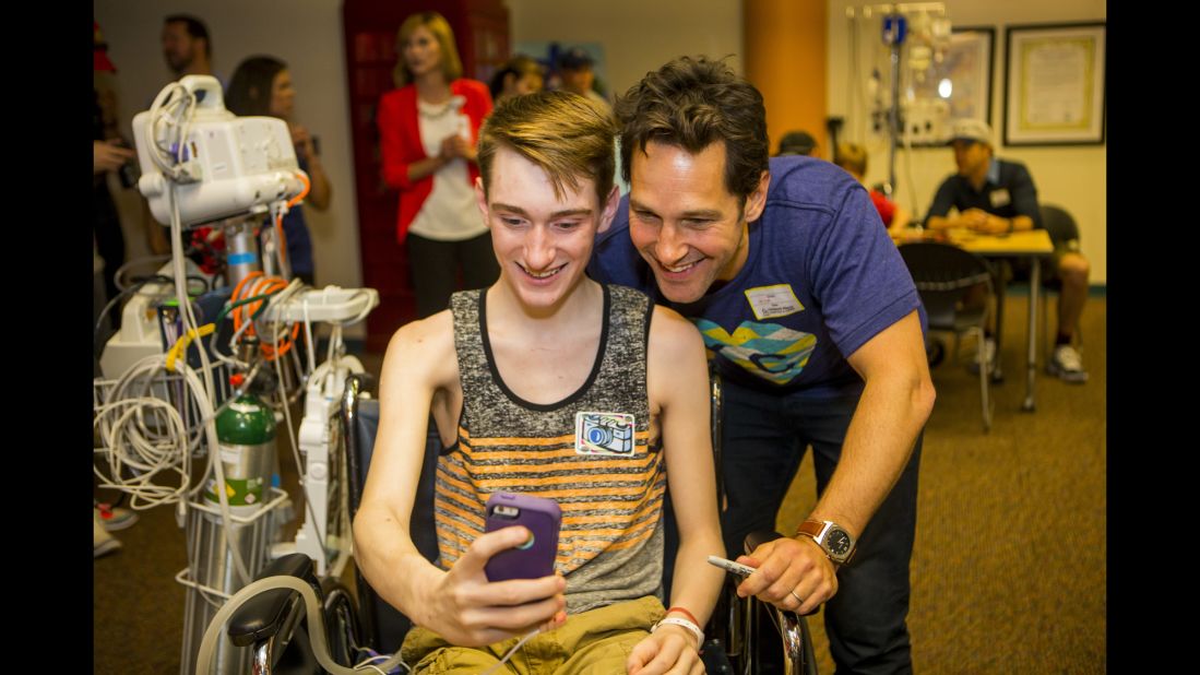 Actor Paul Rudd poses for a fan at a hospital in Kansas City, Missouri, on Friday, June 19.