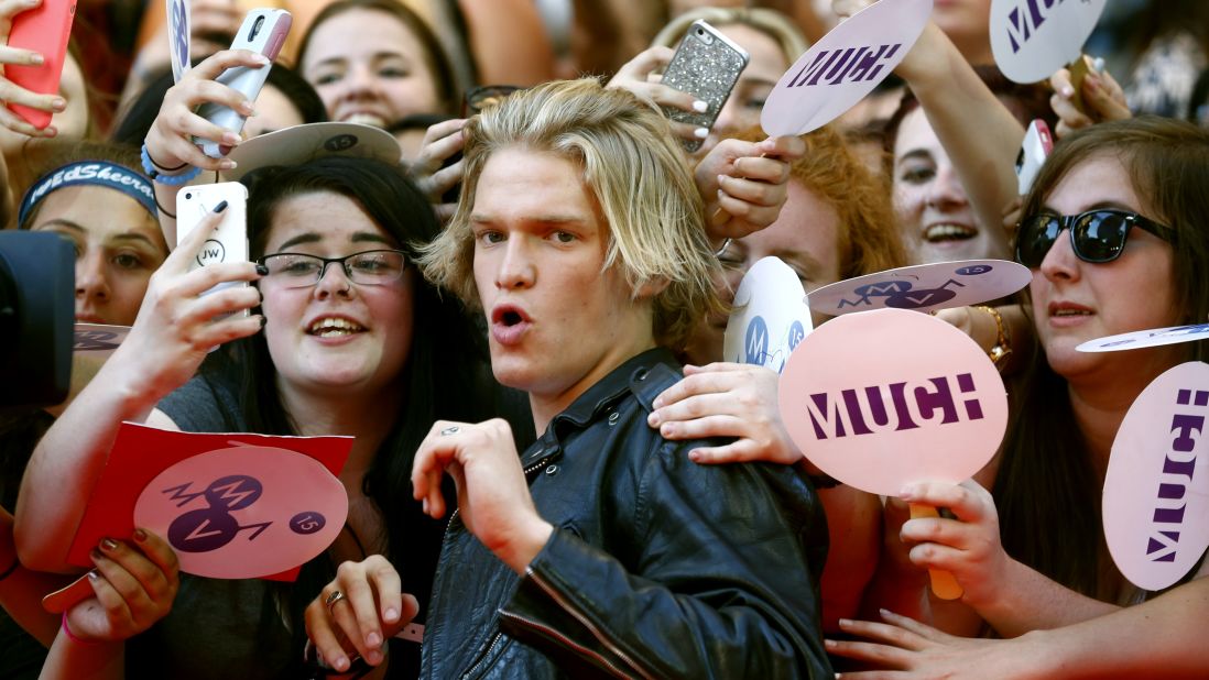 Singer Cody Simpson visits with fans in Toronto after arriving to the Much Music Video Awards on Sunday, June 21.