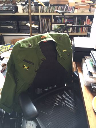 On the back of Smith's desk chair is a jacket that belonged to Usain Bolt.