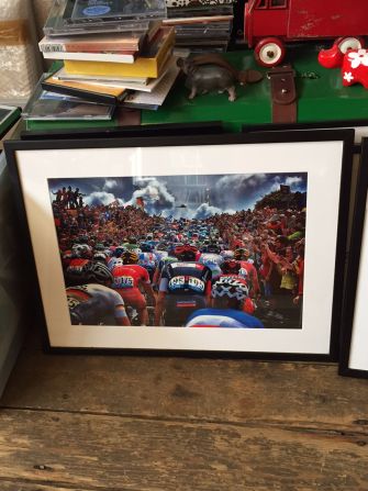 Among the boxes of famed photographs in his office is this one of the opening stage of the 2014 Tour de France, held in Yorkshire, England.