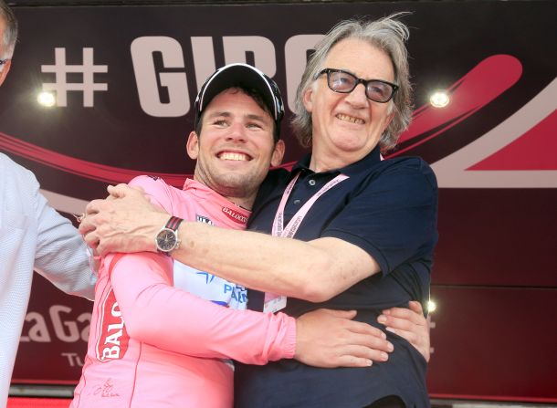 Smith celebrates with Cavendish after his win in the opening stage of the 2013 Giro d'Italia. The pink jerseys for the race were designed by Smith.