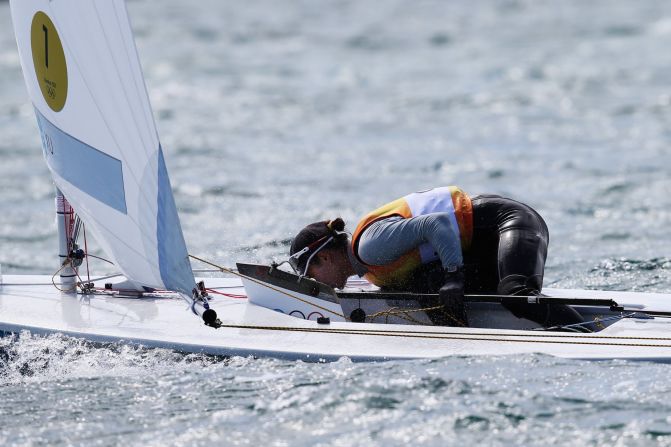 Now studying for a management degree in the UK, Lily, as she prefers to be called, kisses her boat in celebration at London 2012.