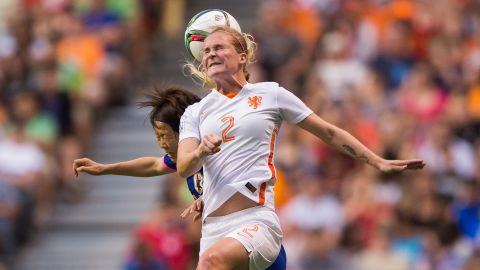 Dutch player Desiree van Lunteren heads the ball during the match against Japan.