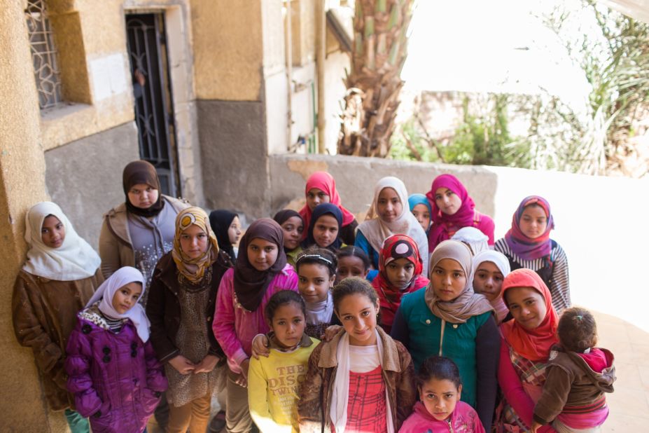 U.N. agencies have adopted a school-based model to try to educate girls about the procedure. Here, in a photo provided to CNN by the UNFPA, a group of girls stand outside the Society of Islamic Center near Sohag on January 31. 
