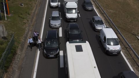 Cars get stuck in a traffic jam on the way to the Paris Orly Airport  on June 25. 