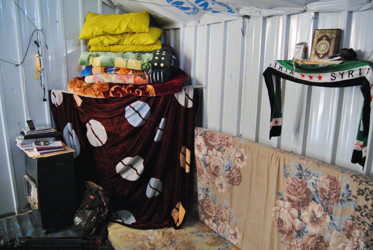 Mazoun's family home in Daraa, Syria had a big yard and four rooms. Now she shares this 250 square-foot metal container with her parents and 3 siblings.