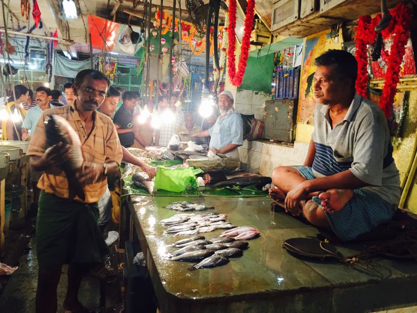 Fresh-water fish is an important staple in West Bengali cuisine.  At Kolkata's Lake Market, fishmongers sell a wide variety of locally caught species, including carp, cat fish and prawns. No chairs here. Sellers perch themselves on the table, directly behind their wares.  