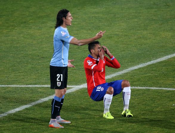 Gonzalo Jara falls to the floor after Edinson Cavani reacts to the Chilean's unwanted attention. The Uruguayan player was sent off after hitting the defender following his unusual action. Chile went on to win the 2015 Copa America quarterfinal 1-0. 