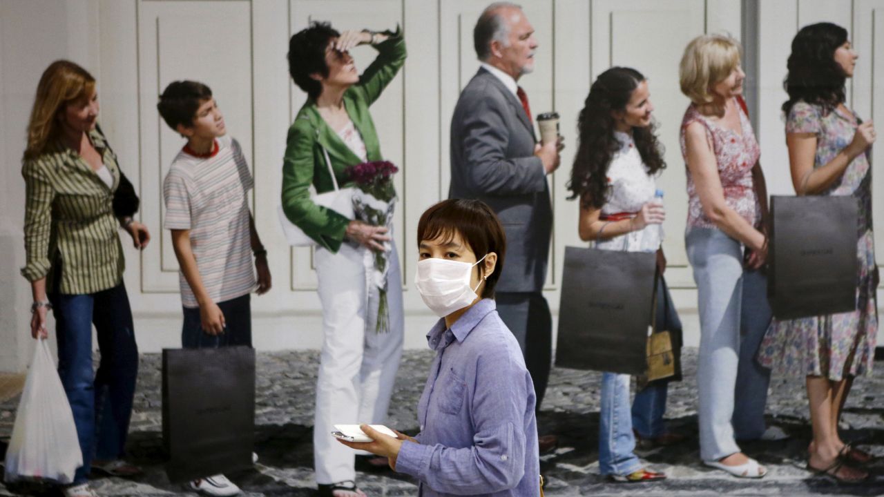 A woman wears a mask at an underground shopping district in Seoul, South Korea, on Friday, June 19. <a href="http://www.cnn.com/2015/06/15/asia/south-korea-mers-outbreak/index.html" target="_blank">An outbreak of MERS</a> -- Middle East Respiratory Syndrome -- has killed two dozen people in the country, officials said.