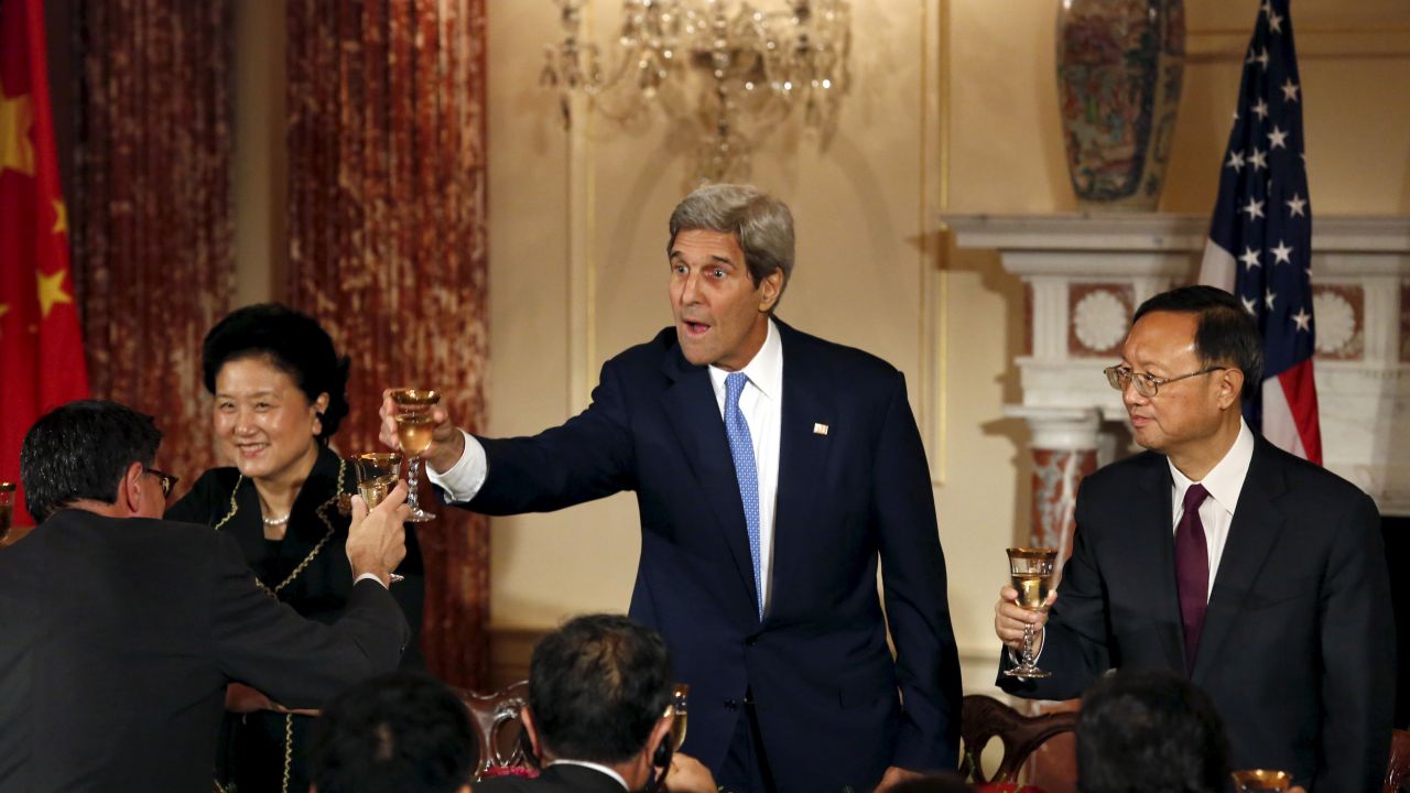 U.S. Secretary of State John Kerry, center, toasts Treasury Secretary Jack Lew during a joint banquet with Chinese officials Tuesday, June 23, in Washington. Next to Kerry are Chinese Vice Premier Liu Yandong, left, and Chinese State Councilor Yang Jiechi.