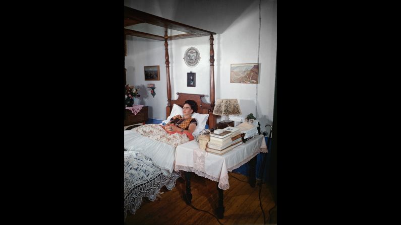 As a teenager, Kahlo was critically injured in a bus accident and confined to a bed. She suffered from ill health for the rest of her life. Here, she is shown in her bedroom in 1951. 
