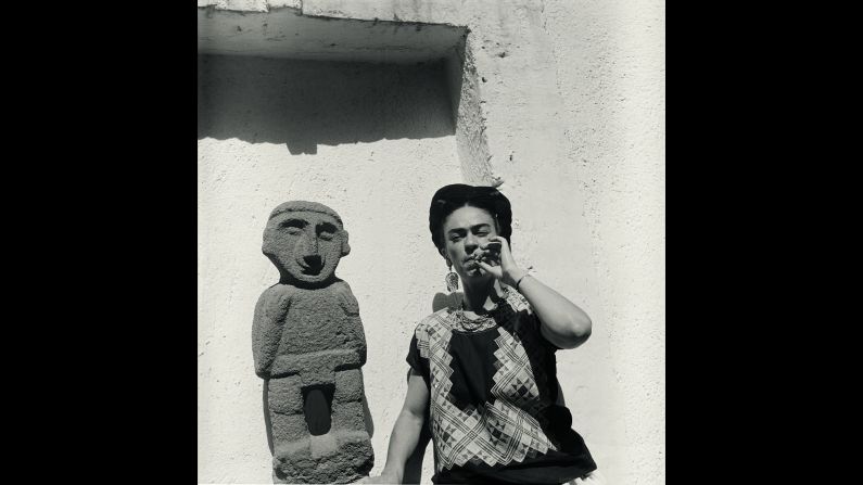 Kahlo smokes in her garden in 1951. The German-born Freund was an accomplished documentary photographer and became famous for her portraits of writers and artists like Kahlo. 