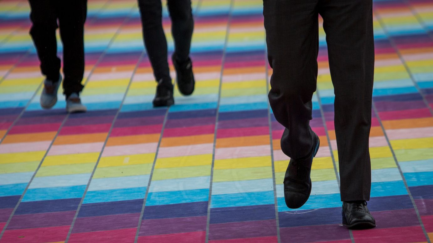 People traveling across London Bridge on Monday, June 22, walk on a 300-meter (984-foot) carpet designed by Gemma Cairney. The installation, "Love Mondays," was created as part of the <a href="https://sparkyourcity.com" target="_blank" target="_blank">"Spark Your City"</a> project.