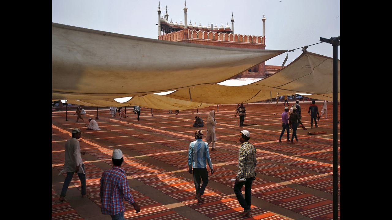 Muslims in New Delhi walk outside the Jama Masjid mosque on June 19 after the first Friday prayers of Ramadan.