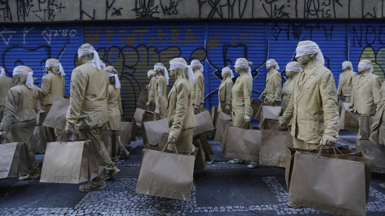 A Brazilian theater group called Desvio Coletivo performs its piece <a href="http://hemisphericinstitute.org/hemi/en/enc13-performances/item/2032-enc13-desvio-pi" target="_blank" target="_blank">"Blind"</a> in the streets of Sao Paulo, Brazil, on Saturday, June 20. The performance was said to address the facade of modern life.