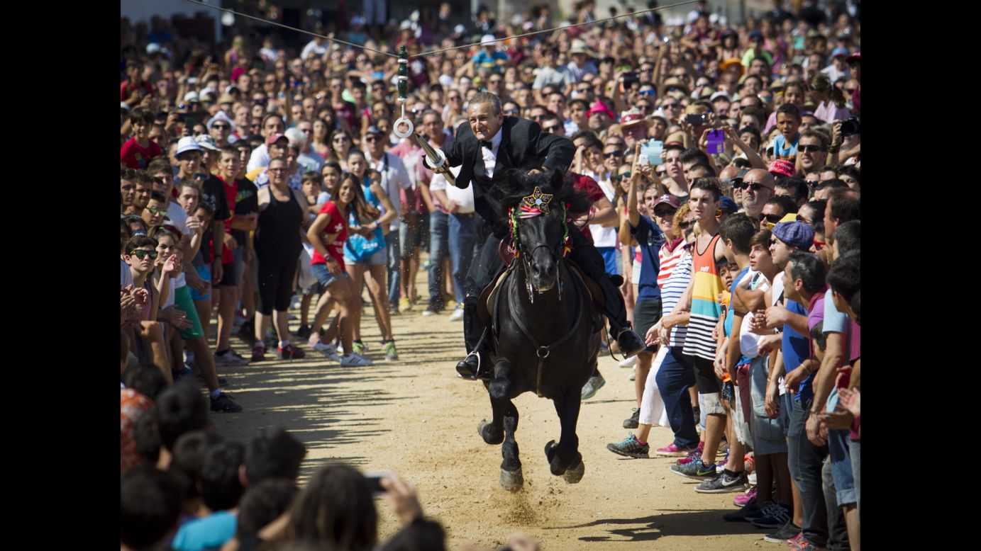 A horseman aims his lance during the San Juan festival in Ciutadella, Spain, on Wednesday, June 24.