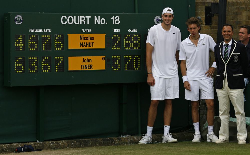 Five years ago at Wimbledon, Nicolas Mahut (center) lost the longest match in tennis history to John Isner (left). 