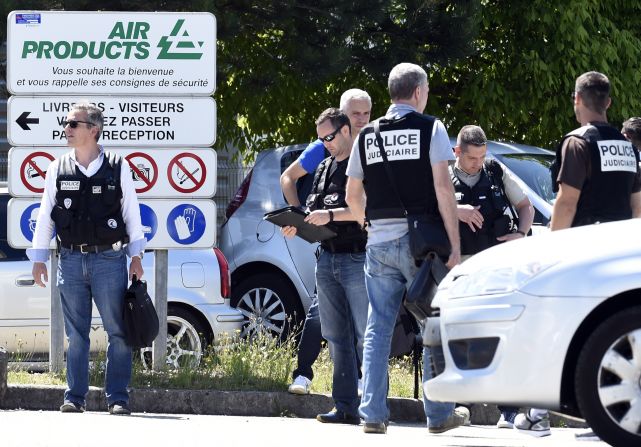 Police secure the entrance of the factory on June 26.