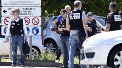 Caption:French police secure the entrance of the Air Products company in Saint-Quentin-Fallavier, near Lyon, central eastern France, on June 26, 2015. An attacker carrying an Islamist flag killed one person and injured several others at a gas factory in eastern France, according to a legal source. The suspected attacker entered the factory and set off several small explosive devices, the source said. A decapitated body was found nearby the factory, another source said. AFP PHOTO/PHILIPPE DESMAZES (Photo credit should read PHILIPPE DESMAZES/AFP/Getty Images)