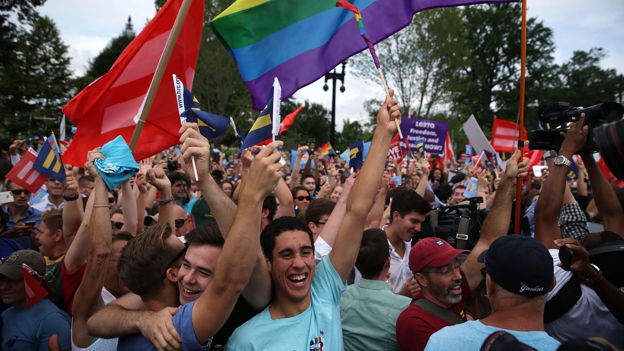 WASHINGTON, DC - JUNE 26:  Same-sex marriage supporters rejoice after the U.S Supreme Court hands down a ruling regarding same-sex marriage June 26, 2015 outside the Supreme Court in Washington, DC. The high court ruled that same-sex couples have the right to marry in all 50 states. (Photo by Alex Wong/Getty Images)