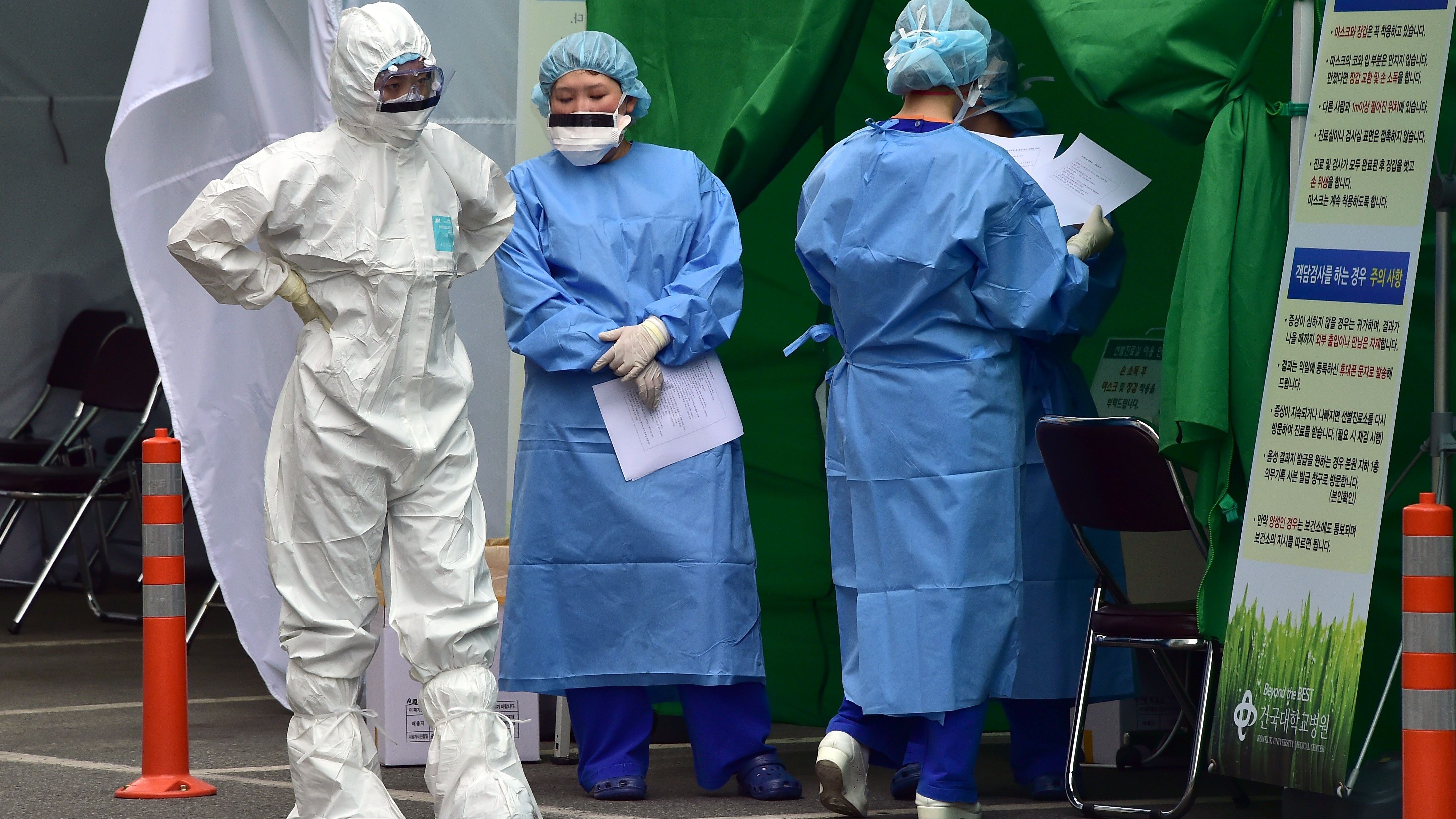 South Korean medical workers wear protective gear at a separated clinic for MERS patients at Konkuk University Hospital, Seoul.
